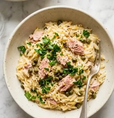 Creamy Tuna and Orzo 1 Creamy Tuna and Orzo dish served in a bowl with garnishes