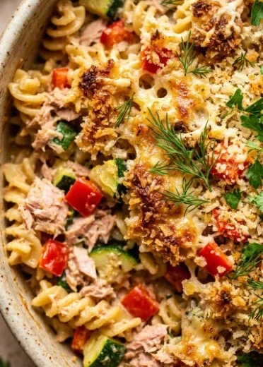 Creamy tuna noodle casserole topped with breadcrumbs and fresh herbs