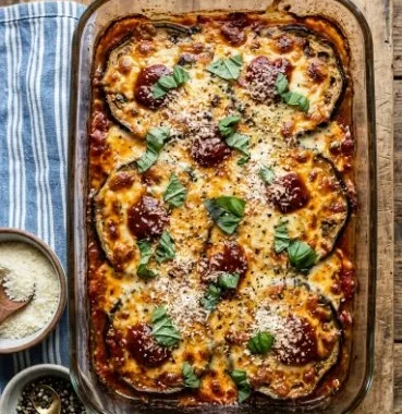 Eggplant Parmigiana Casserole 2 Delicious Eggplant Parmigiana Casserole topped with cheese and herbs