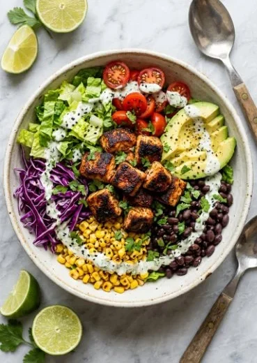 Bowl of delicious fish tacos topped with fresh ingredients and salsa