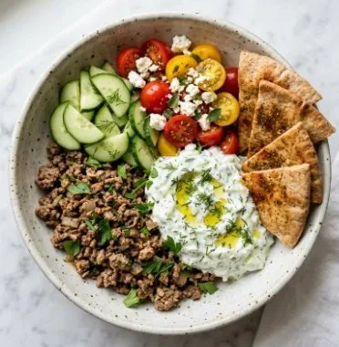 Greek Ground Turkey Gyro Bowls 1 Greek ground turkey gyro bowl with fresh vegetables and tzatziki sauce