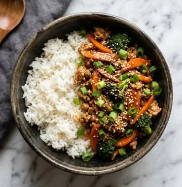 Ground turkey teriyaki stir fry served with colorful vegetables in a bowl