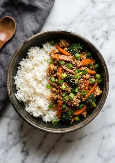 Ground turkey teriyaki stir fry served with colorful vegetables in a bowl