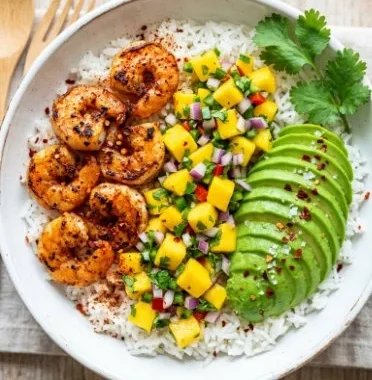 Healthy shrimp avocado bowls with fresh ingredients and vibrant colors.