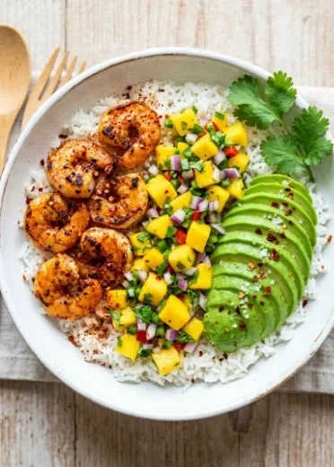 Healthy shrimp avocado bowls with fresh ingredients and vibrant colors.