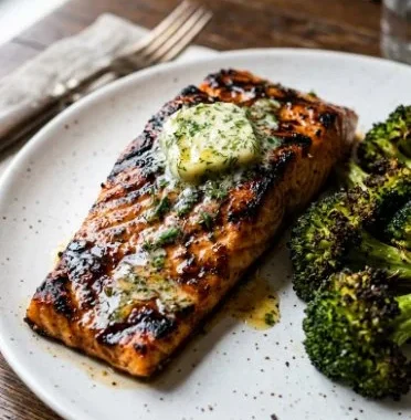Keto Sheet Pan Salmon with Lemon Herb Butter 1 Keto Sheet Pan Salmon with Lemon Herb Butter on a plate