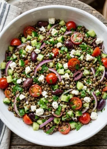 Colorful and nutritious lentil salad with vegetables and dressing