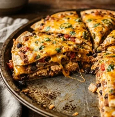 Mexican Tortilla Casserole 1 Layers of delicious Mexican Tortilla Casserole with cheese and toppings