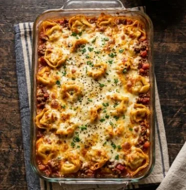 Million Dollar Baked Tortellini Casserole 2 Delicious Million Dollar Baked Tortellini Casserole served in a baking dish