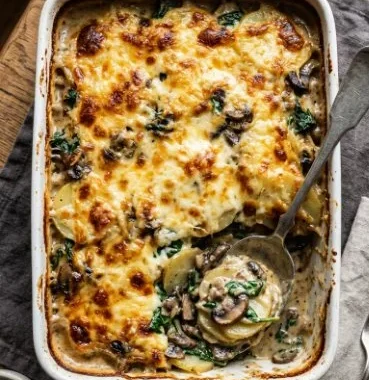 A hearty potatoes and mushrooms one-dish meal served in a rustic bowl.