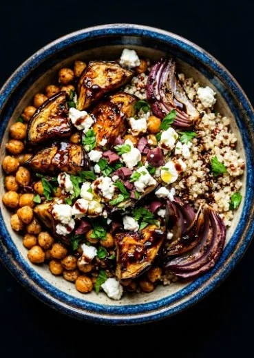 Roasted eggplant gyros bowl with fresh vegetables and sauce