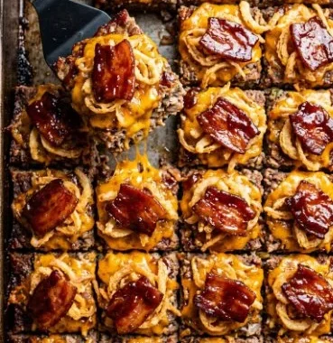 Sheet pan BBQ bacon cheeseburger meatloaf served with toppings