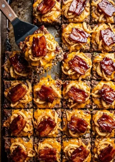 Sheet pan BBQ bacon cheeseburger meatloaf served with toppings