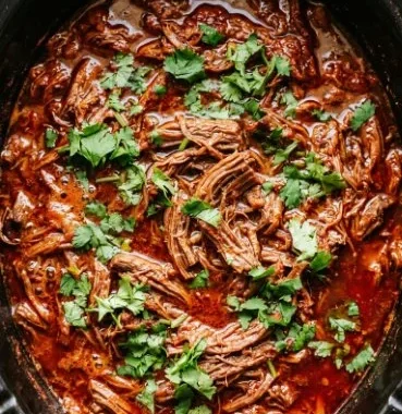 Slow Cooker Birria 1 Delicious Slow Cooker Birria served in a bowl with toppings