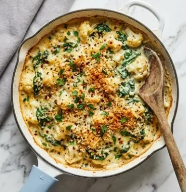 Vegan Cauliflower Gratin 1 Vegan cauliflower gratin dish topped with breadcrumbs and fresh herbs