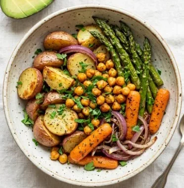 Colorful vegan sheet pan dinner with roasted vegetables and chickpeas
