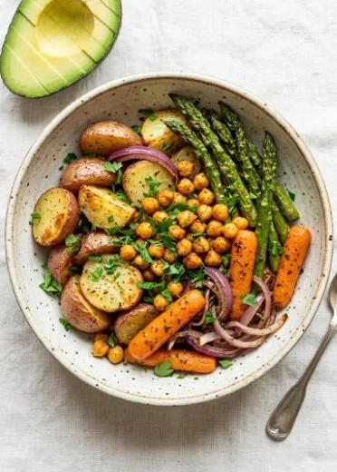 Colorful vegan sheet pan dinner with roasted vegetables and chickpeas