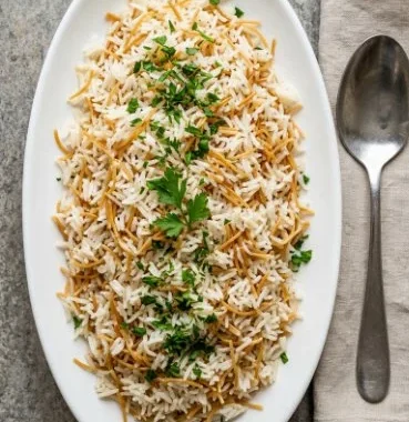 A bowl of deliciously cooked vermicelli rice with colorful vegetables.
